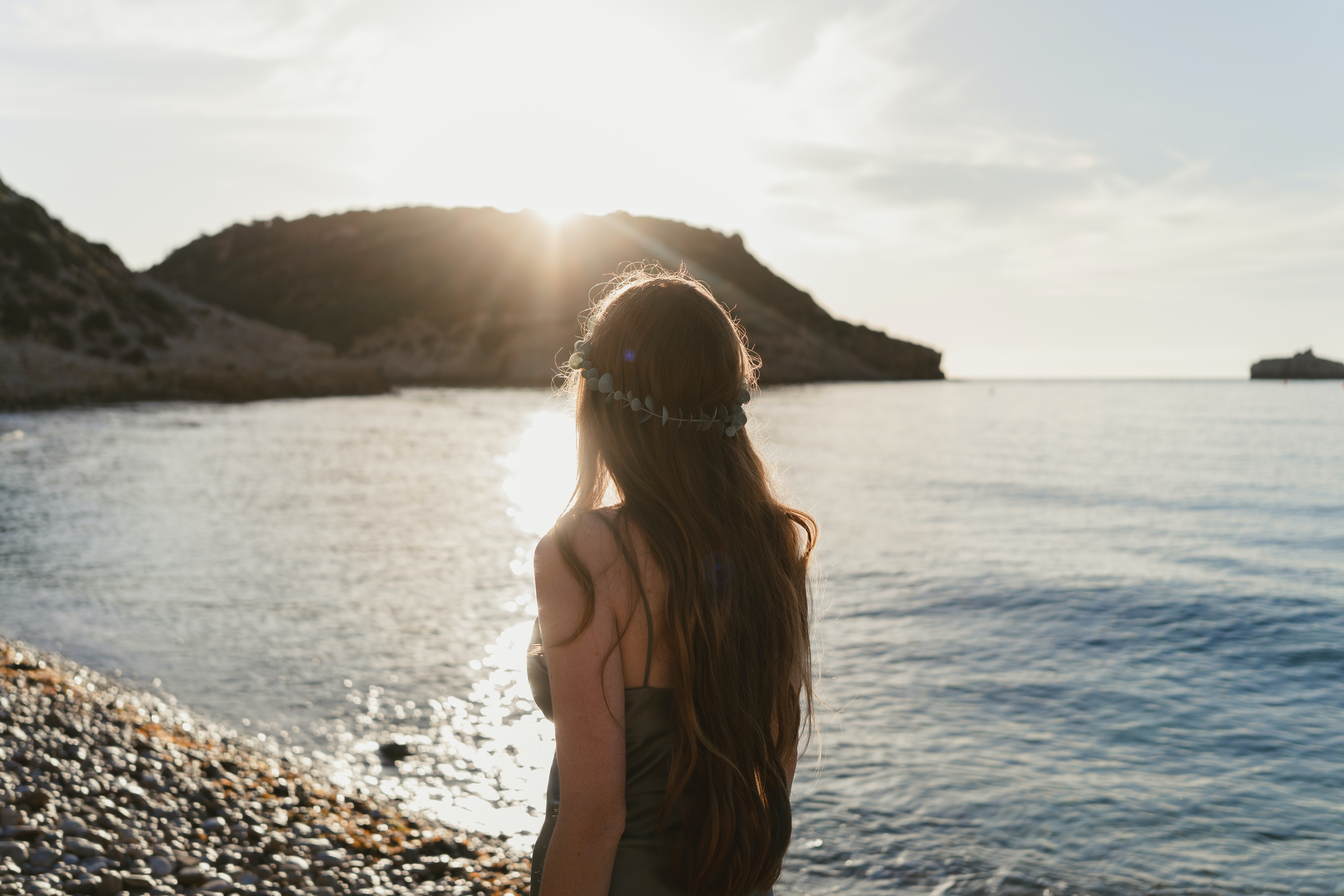 Photo by MEUM MARE: https://www.pexels.com/photo/back-view-of-woman-looking-into-sea-12504162/